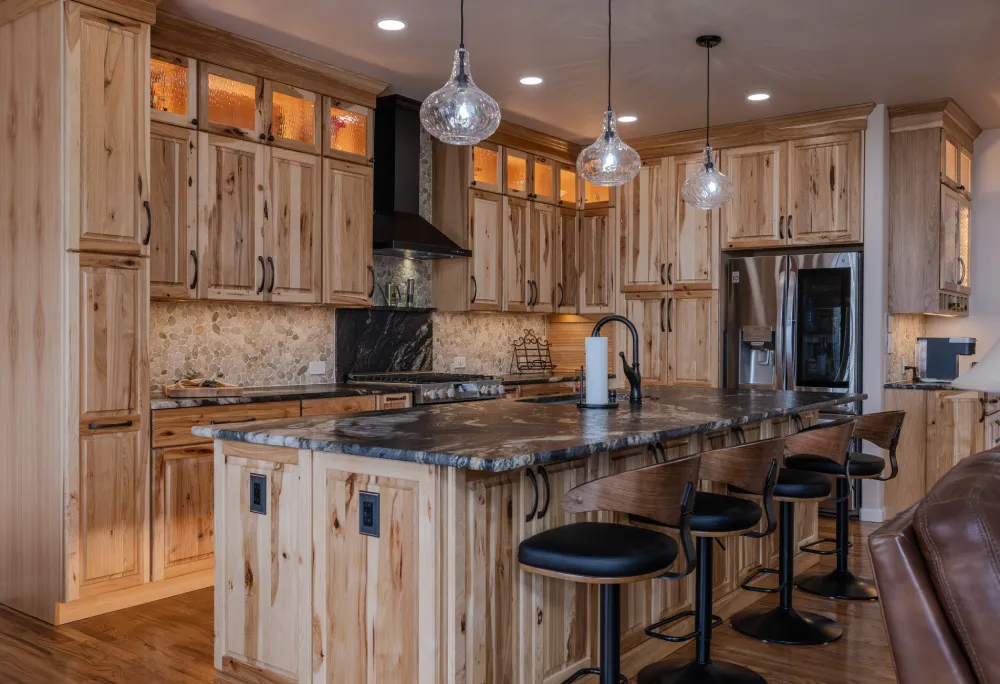 Custom cabinetry solutions in a modern Wabasso Beach home, featuring built-in office, entertainment center, laundry room, and pantry cabinetry for organized living spaces.
